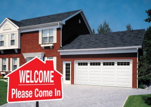 Welcome sign with garage doors