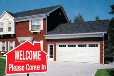 Welcome sign with garage doors